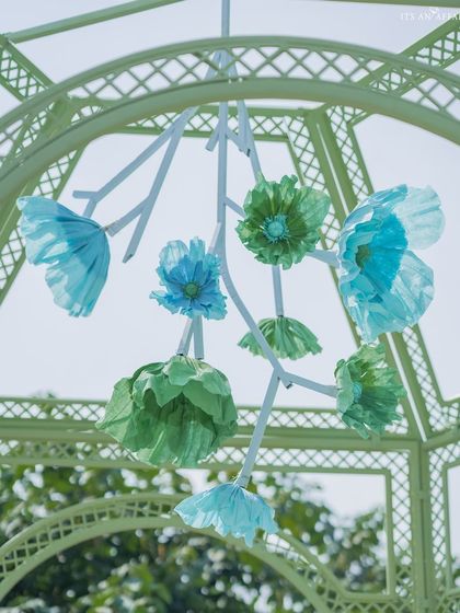Another view of the artistic paper flower installation, showing the different shapes and shades that create a beautiful, sculptural mobile.