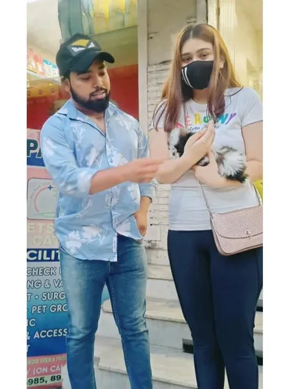 The customer's smile is the key to my success. Here I am giving some final tips to a new owner about her adorable Shih Tzu puppy.