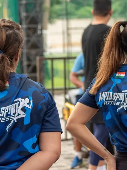 Two members of our community at the Independence Day event, proudly wearing our team apparel. This sense of belonging and shared purpose is at the heart of what we do.