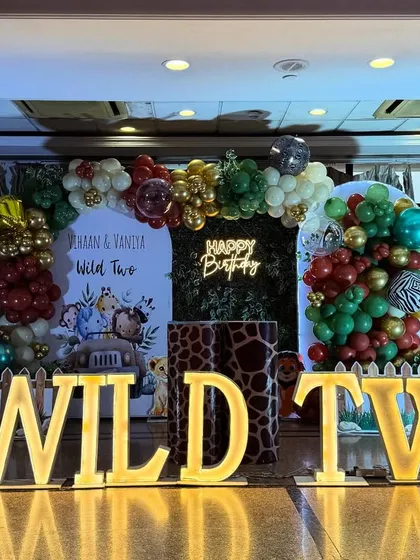 A straight-on shot of the "Wild Two" stage, highlighting the custom backdrop and the detailed animal-print plinths used for display.
