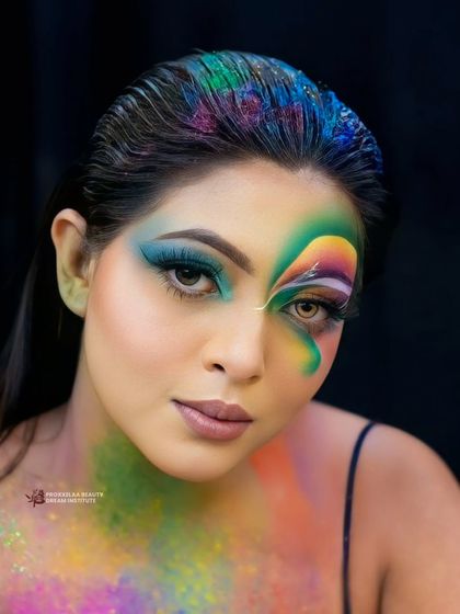 The spirit of Holi is all about celebrating life with joy. This creative look uses a rainbow of colors across the face and hair to capture the festival's vibrant energy.