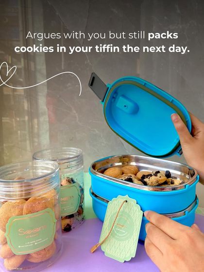 A mother's love is like this: she argues with you but still packs cookies in your tiffin the next day. This image captures that feeling, showing my cookies being packed into a lunchbox.