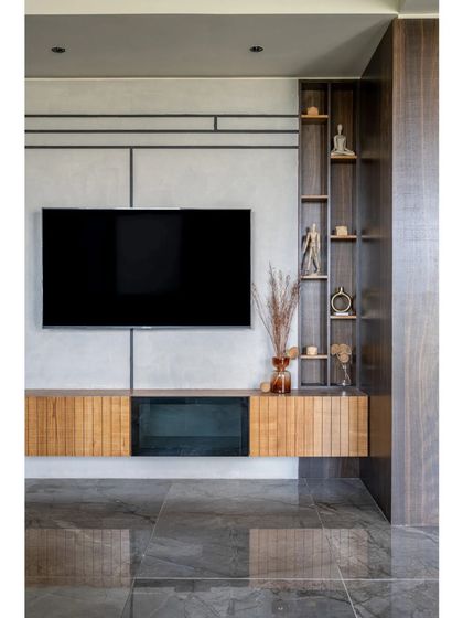 A closer look at the custom media unit, where I combined open and closed storage. The design features clean lines on the wall and natural wood textures, creating a functional focal point that is also a piece of minimalist architectural detailing.