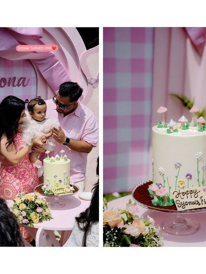 Capturing the cake-cutting moment at a 'Bow & Bunny' first birthday. The family celebrates in front of the custom pink gingham backdrop, next to a beautiful wildflower-themed cake.
