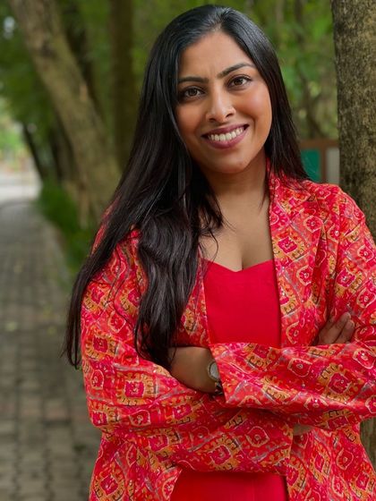 A confident smile during a team-building offsite. As a facilitator, I create a comfortable and inclusive environment where everyone feels encouraged to participate.