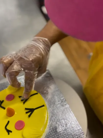 A close-up of the decorating process for our Easter cake. Every detail is done by hand.