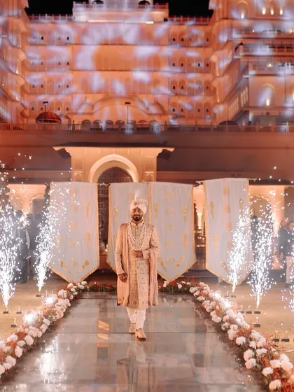 Your royal entry awaits. We specialize in designing grand, jaw-dropping entries for grooms against majestic backdrops like this palace, making it a moment fit for a king.
