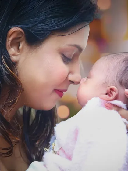 An intimate, close-up shot capturing a tender moment between a mother and her newborn. These natural, emotional photos are timeless.