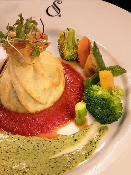 Our Crespella, a delicate savory crepe filled with delicious ingredients and served with vibrant sauces, is a bundle of bliss.