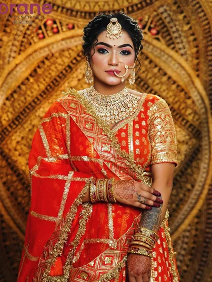 This portrait highlights the heavy Kundan jewelry and the perfectly executed makeup, a staple in our bridal course.