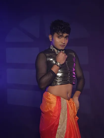 A powerful stance from the same dance shoot. The makeup is designed to be expressive and visible even from a distance.