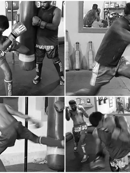 The heavy bag is an important tool for developing power and perfecting form when training solo. Here, one of my upcoming fighters refines his kicking and punching combinations, building muscle memory with every strike.
