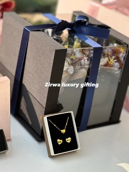 A gift that combines beauty and elegance. This Valentine's hamper includes a delicate heart-shaped jewelry set along with a beautiful floral box.
