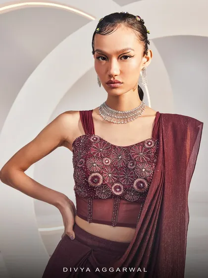 The Isla Saree Set's corset blouse, a testament to exquisite craftsmanship with its rich embellishments and visionary design.