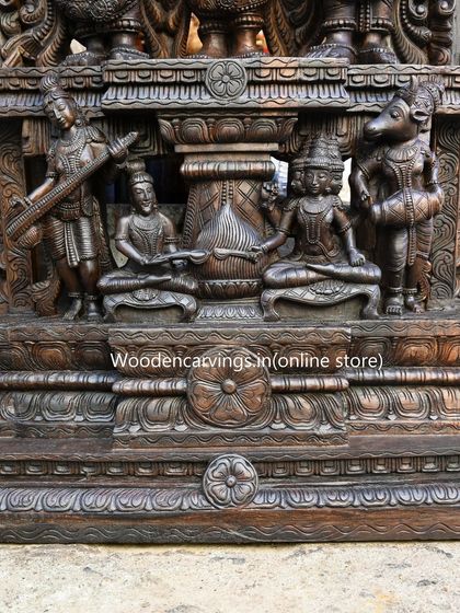 The base of the 87-inch Thirukalyana sculpture features smaller, exquisitely carved figures of celestial musicians and attendants, demonstrating that no detail is too small for our attention.
