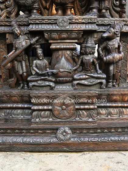 A detailed view of the base of the 87-inch Meenakshi Thirukalyanam sculpture. Even the lower sections feature intricate carvings of musicians and attendants, ensuring the entire masterpiece is rich with story and artistry from top to bottom.