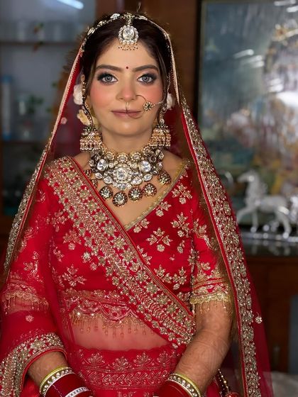 A close-up showcasing the detailed eye makeup and flawless skin. The blue undertones in her eyes are beautifully highlighted with this look.