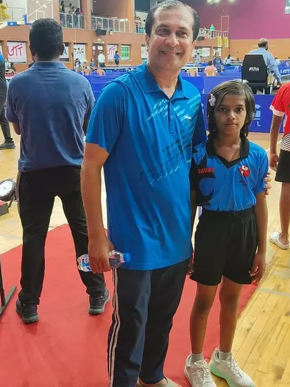 We take our players to the next level. Here I am with our player Ghanavi at a national tournament, showcasing our commitment to competing on the biggest stages.