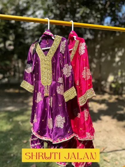 My Gota Patti sharara sets hanging in the sun, showing off their rich colors and beautiful gold work.