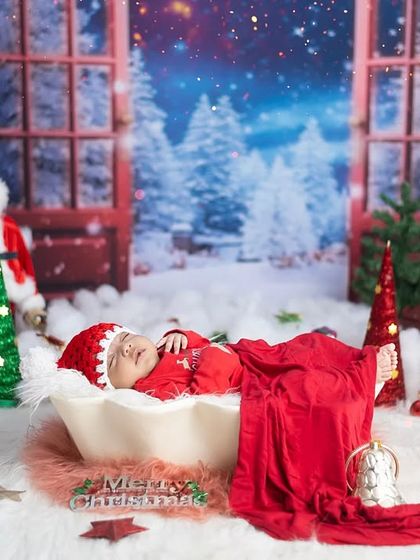 A full view of one of our elaborate Christmas newborn sets. We use layers of props and soft lighting to create a magical winter wonderland for your baby.