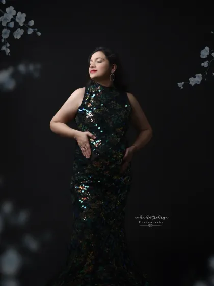 This pose, looking off-camera, adds a touch of elegance and poise to the glamorous sequin gown look.