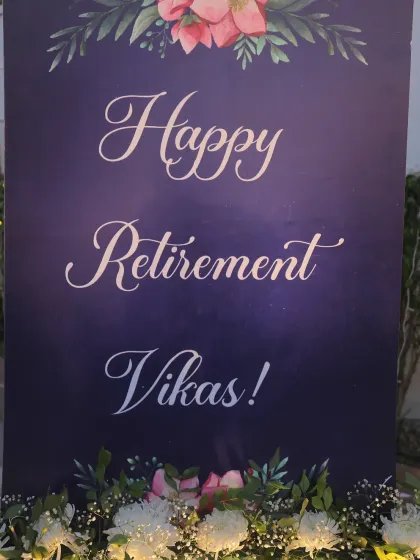 A personalized welcome sign for the retirement party, elegantly designed with a floral motif.