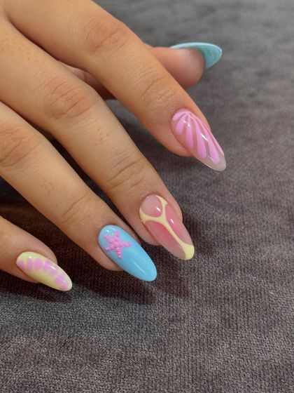 Another view of these dreamy Bali-inspired vacation nails on long stiletto extensions.