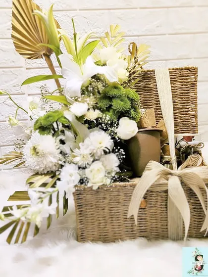 Another angle of the sustainable trunk hamper for Google, showing the lush arrangement of fresh white and green florals. The combination of a reusable basket and fresh flowers makes for an impressive and eco-conscious gift.