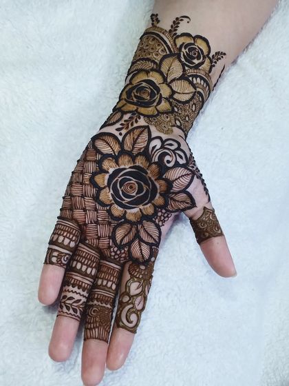 A single hand design featuring a black rose at the center, surrounded by a mix of basket-weave patterns and lighter floral motifs.