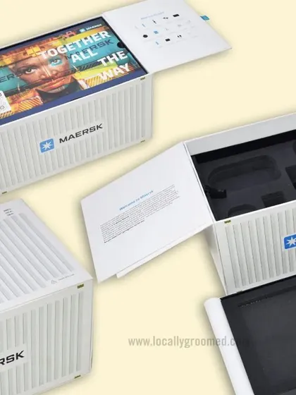 This unique welcome kit for Maersk was designed to look like one of their shipping containers. The innovative packaging opens to reveal a curated selection of branded merchandise, creating a truly memorable unboxing experience.