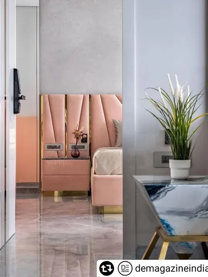 A glimpse into the daughter's bedroom, showing the soft pink bed and the ombre wardrobe doors.