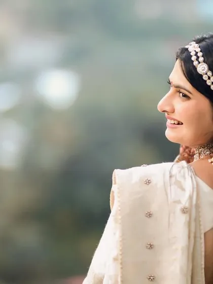 A beautiful portrait of a bride at her destination wedding in the mountains. The soft, natural light and the serene backdrop highlight her elegance and joy.