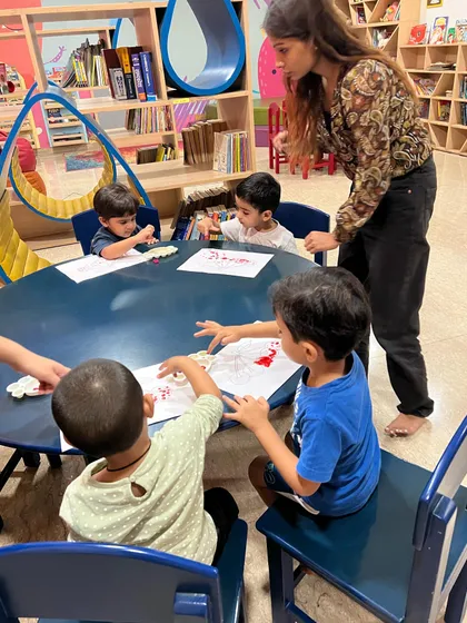 A typical art session at our round table, where everyone gets to participate. I make sure to give each child individual attention, encouraging them and helping them with their techniques.
