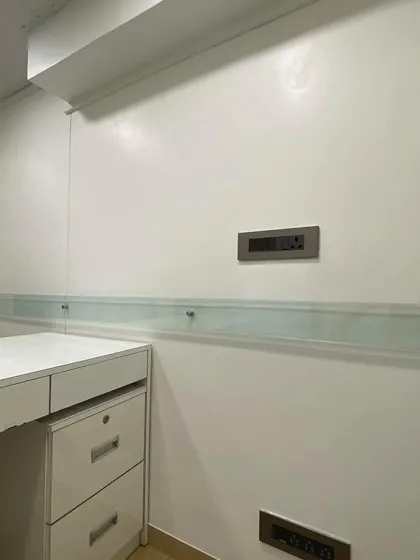 A close-up of the detailing in the CA's office, showing the clean lines of the desk, integrated drawers, and the placement of electrical switchboards. I ensure all wiring and electrical work is seamlessly integrated into the design for a polished and professional look.
