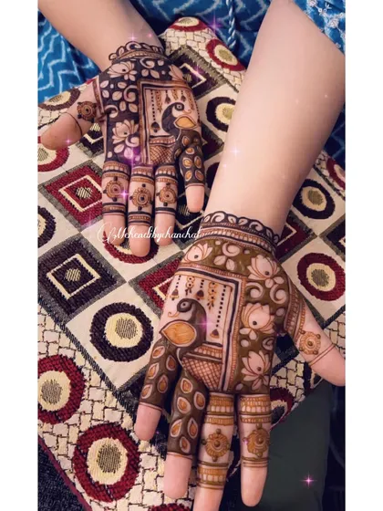 A full view of the peacock and lotus themed Karwa Chauth mehendi, showing how the designs complement each other.