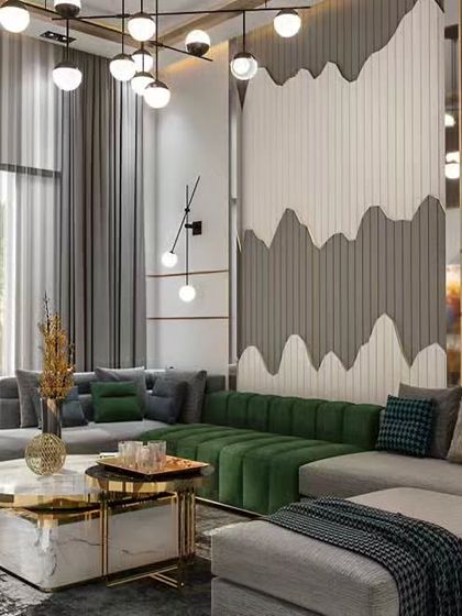A luxurious living room featuring a large sectional sofa with contrasting green and grey upholstery. The statement wall combines fluted panels and a unique wave-like pattern, complemented by modern lighting and a marble coffee table.