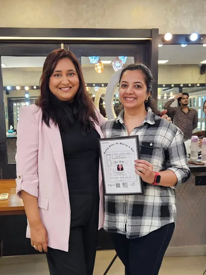 Celebrating the success of another student on her certification day.