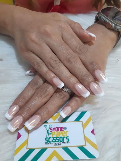 You can never go wrong with a classic. This is a perfectly executed traditional French manicure with clean white tips on medium-length square extensions. Timeless and elegant.