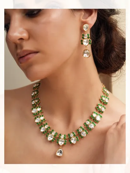 A delicate and lightweight polki and emerald necklace set, ideal for pre-wedding functions or for a guest who loves elegance.