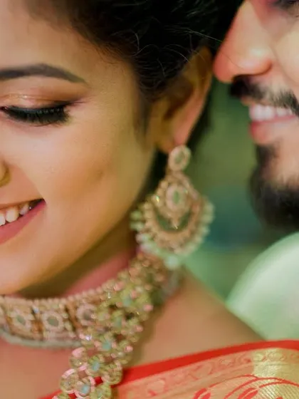 A close-up on the shimmering eyeshadow and the bride's happy smile.