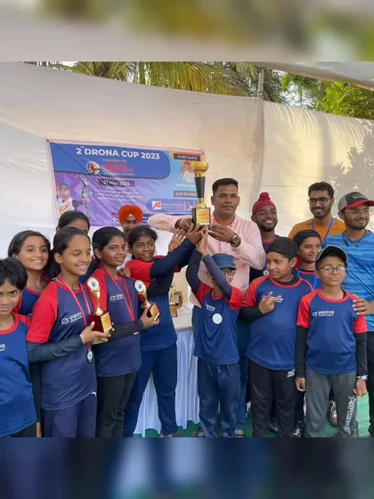 The winning team celebrates with their trophy at the 2nd Drona Cup. Moments like these build lasting memories and strengthen our team bond.