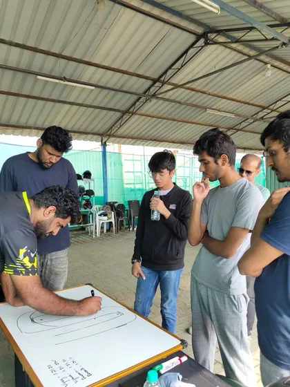 Success on the track starts with strategy in the pits. We dedicate time to classroom sessions, where our coaches use whiteboards to break down track maps, explain racing lines, and discuss strategy with our drivers.