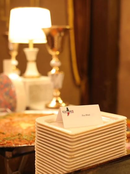 A simple yet elegant detail from one of my live stations. The 'Pan Bhaji' label and clean stack of plates show my focus on organization and clear communication for guests.