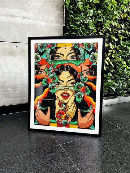 The framed 'Feminine Gaze' artwork on display, ready to be installed. The large scale makes it an impactful statement piece.