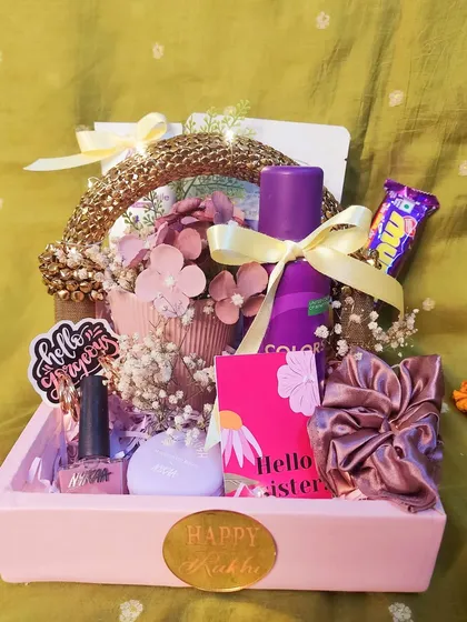 This beautiful leatherette gift basket is another great option for your sister or bhabhi. It's filled with beauty products, a personalized mug, and sweet treats.