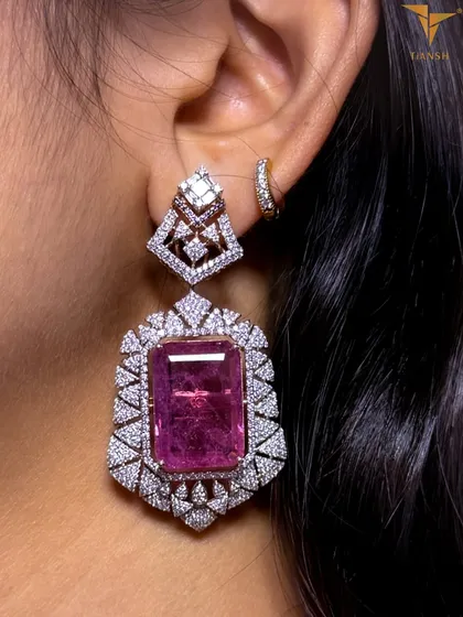 These matching earrings complete the regal bridal set. The large pink tourmaline is surrounded by a halo of brilliant diamonds, echoing the grace and grandeur of heritage jewellery.