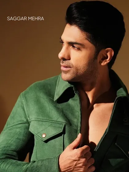 Taaha Shah in a sharp, modern green jacket. The design features a clean silhouette, structured collar, and utility-style pockets, offering a sophisticated yet casual look.