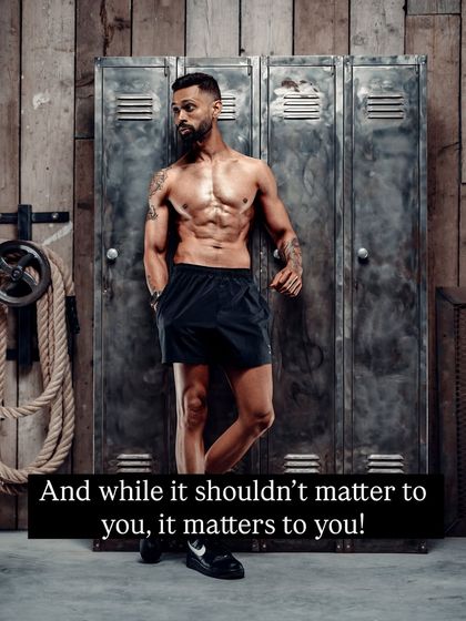 A candid-style shot of me against gym lockers, reflecting on the internal importance of self-perception, even if others say looks don't matter.