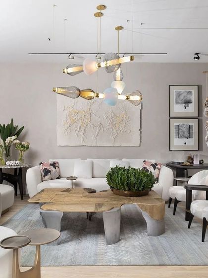 The living room vignette from our stall at India Design 2024. The space featured our new 'Curved Couch' and 'Plateau Coffee Table', paired with stunning lighting to create an environment that was both artistic and inviting.