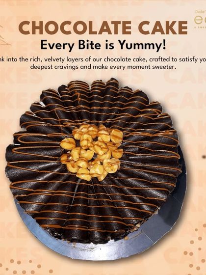 Every bite is yummy. This chocolate cake, decorated with a spiral of ganache and topped with cashews, is crafted to satisfy your deepest chocolate cravings.